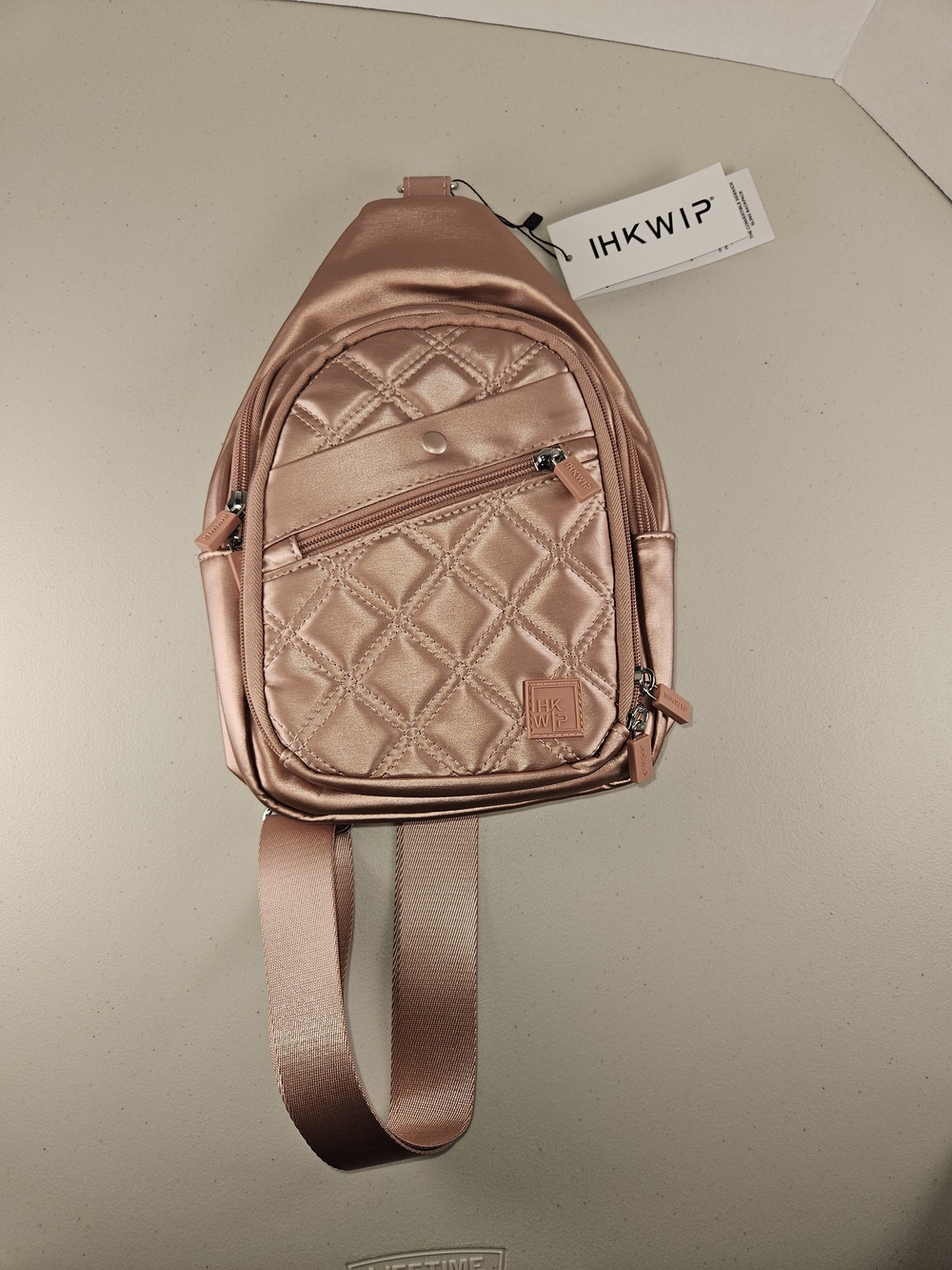 Ihkwip NWT THE CONVERTIBLE SIDEKICK SLING BACKPACK - Rose Gold WOVEN